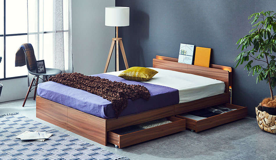 A wooden bed with plenty of storage drawer space